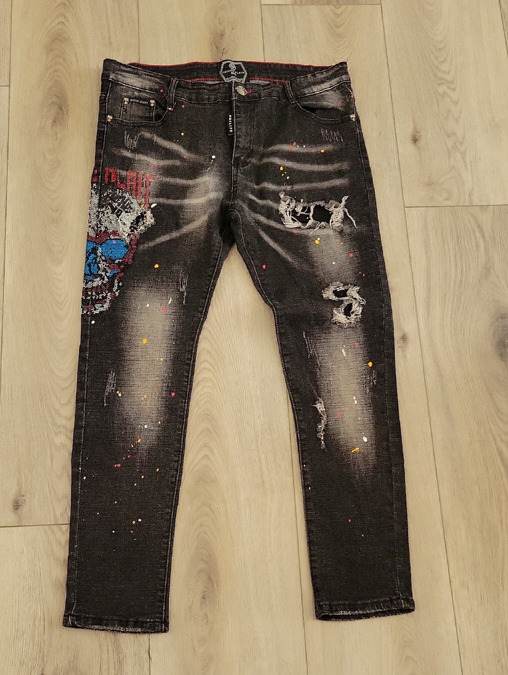 Philipp Plein Black Skinny Jeans with Multicolor Paint-Splatter & Skull Patch